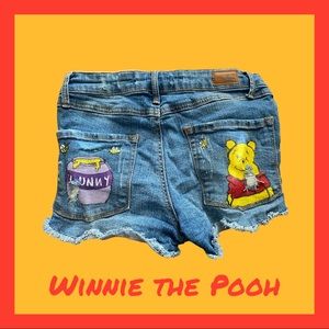 Hand painted “Winnie the Pooh” distressed jean shorts in size 0